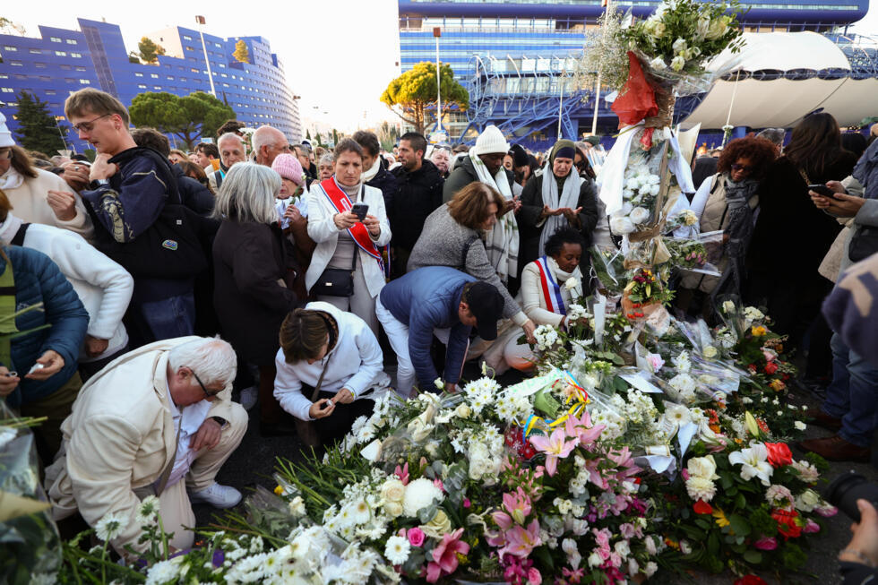 People layed flowers and lit candles in tribute to Mehdi Kessaci at the roundabout where he was murdered and to protest against drug trafficking, in Marseille, France's second-largest city.