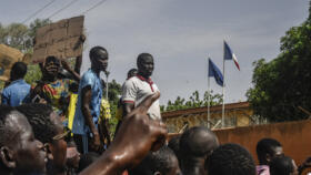 Protesters gather in front of the French Embassy in Niger's capital, Niamey, after attending a rally in support of Niger's junta on July 30, 2023. 