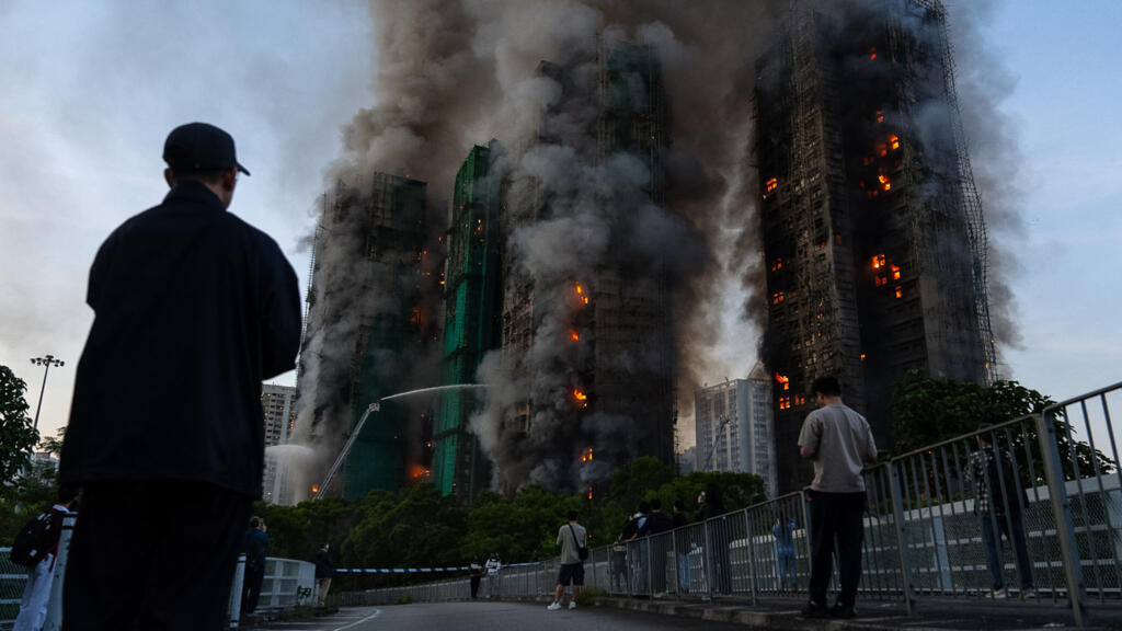 At least 13 killed as fire engulfs Hong Kong high-rise residential blocks