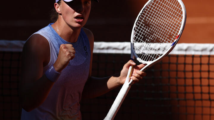 Defending champion Iga Swiatek got past Romania's Jaqueline Cristian in the third round at the French Open