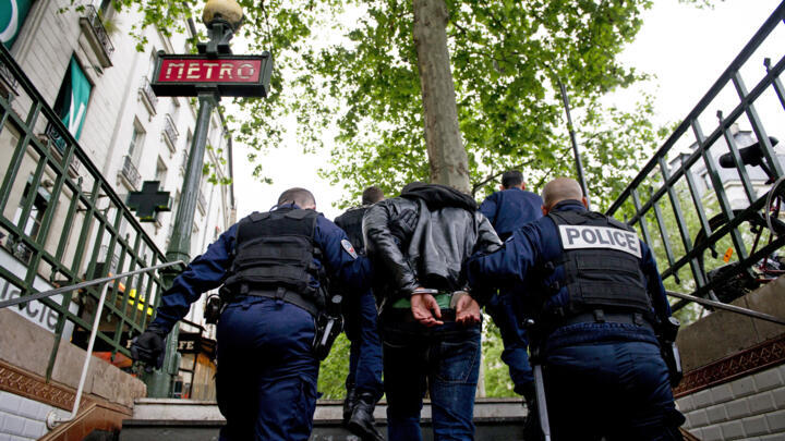 Parisian policemen leave a metro station after arresting two men who allegedly robbed a sleepy traveller on April 27, 2024.