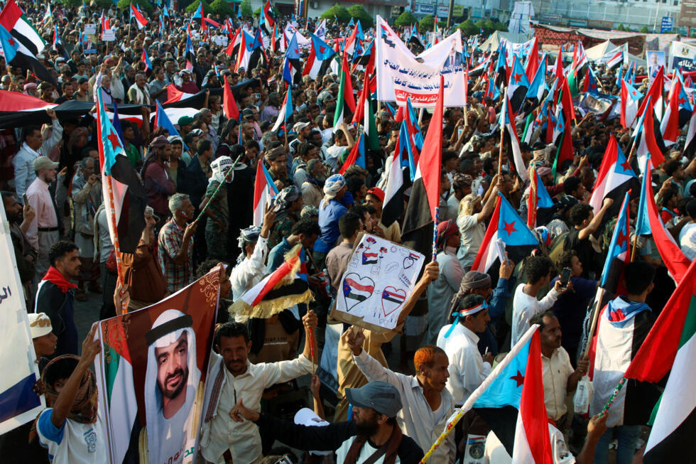 STC supporters hold a poster of UAE President Mohammed bin Zayed al-Nahyan at a rally in Aden in southern Yemen, January 1, 2026.