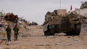 Israeli soldiers stand near the entrance of a Hamas tunnel in Rafah in the Gaza Strip on December 8, 2025
