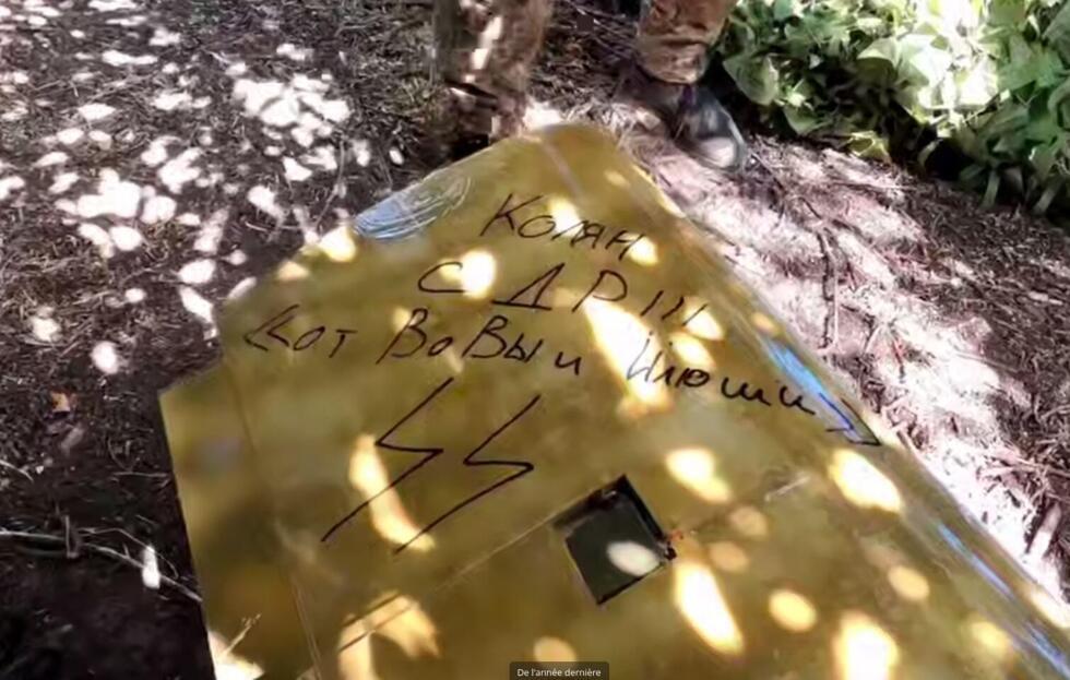 In this screenshot of a video posted on May 30, 2025, on the Rusich Telegram channel, fighters from the unit wrote a birthday message that features the SS symbol.