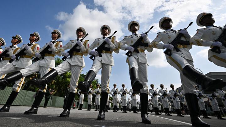 Chinese military personnel take part in a rehearsal for a military parade slated for September 3, 2025.
