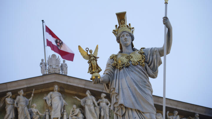 Pallas Athena, greek goddess of wisdom, is seen in front of an Austrian flag at the Austrian Parliament in Vienna, Austria on January 5, 2025
