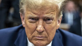 Former US president Donald Trump sits in a Manhattan Criminal Court room before the start of his hush money trial in New York City on May 14, 2024.
