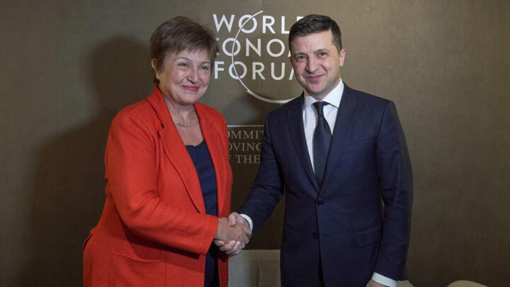 Ukrainian President Volodymyr Zelenskiy, right, shakes hands with International Monetary Fund (IMF) Managing Director Kristalina Georgieva during the 50th annual meeting of the World Economic Forum.
