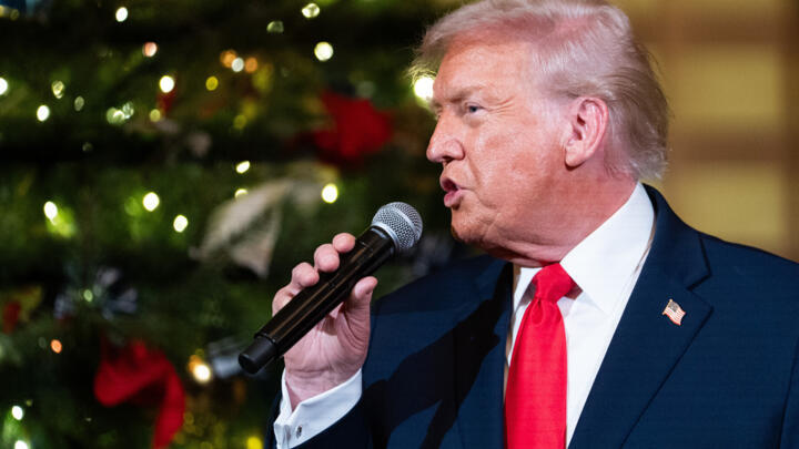 US President Donald Trump speaks before a concert by Andrea Bocelli in the East Room of the White House.