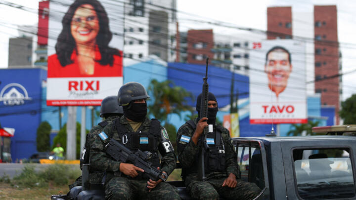 Soldiers escort a convoy carrying ballots as they arrive at an elections logistical centre, after the general election, in Tegucigalpa, Honduras, December 1, 2025.