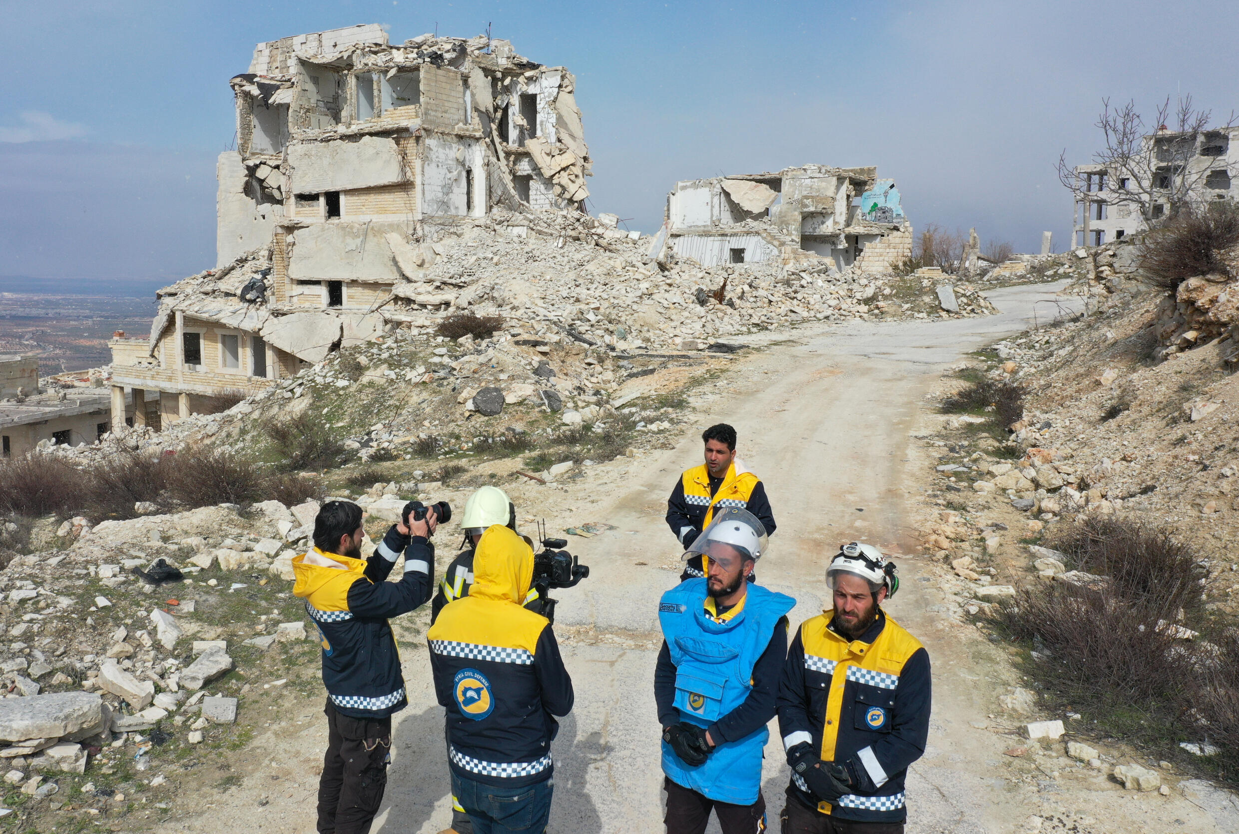 Members of Syria's White Helmets speak about their rescue skills during a video shoot intended for Ukrainian rescuers