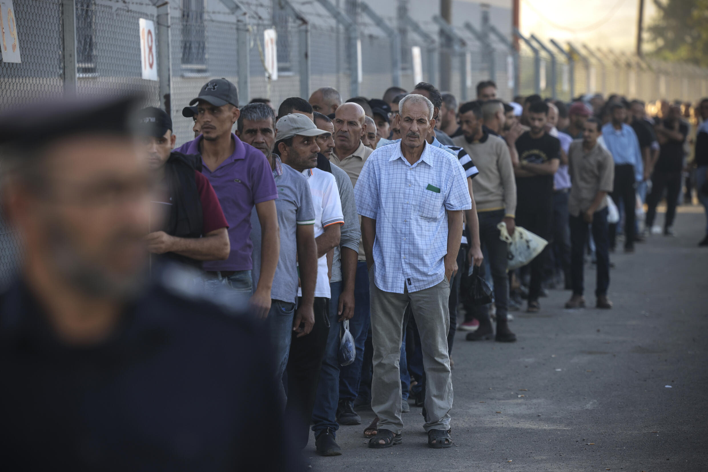 Palestinian labourers queue at the Gaza border to cross into Israel for work late last month. Under an always precarious truce between the two sides, Israel had eased its blockade in return for calm around the border