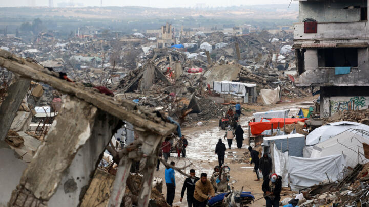 Palestinians flee with their belongings Beit Lahia in the northern Gaza Strip on March 21, 2025.