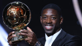 Paris Saint-Germain's French forward Ousmane Dembele reacts after receiving the Ballon d'Or award during the 2025 Ballon d'Or France Football award ceremony at the Theatre du Chatelet in Paris on Sept