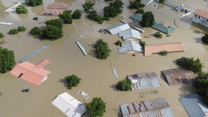This aerial view shows houses submerged under water in Maiduguri on September 10, 2024.