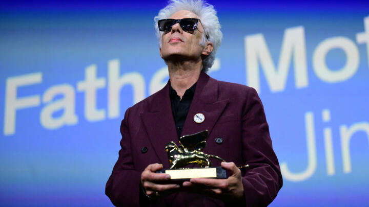 US director Jim Jarmusch poses with the Golden Lion for Best Film