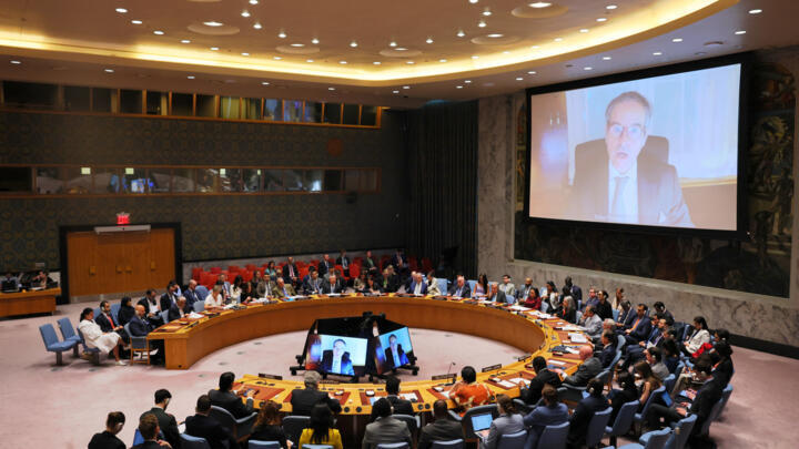 Members of the United Nations Security Council listen Rafael Grossi, Director General of the International Atomic Energy Agency, speaking via video.