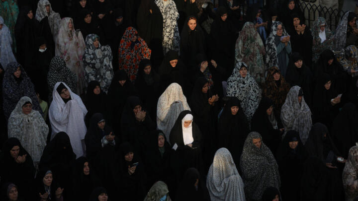 Iranian women pray for rain following a drought crisis at Imamzadeh Saleh shrine in Tehran, Iran, November 14, 2025. 