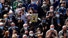 A cover of satirical weekly Charlie Hebdo reading "All of this, just for that'', pictured at a rally in tribute to slain teacher Samuel Paty in Toulouse on October 18, 2020.
