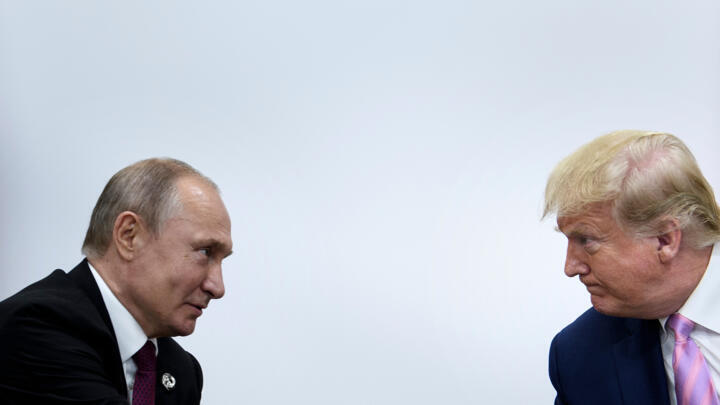 File photo of Vladimir Putin and Donald Trump taken at a G20 summit in Osaka, Japan, June 28, 2019.