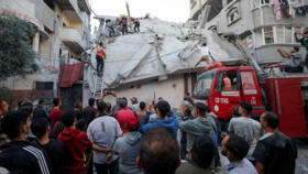 Palestinians inspect the site of an Israeli strike, Gaza City, November 22, 2025. 