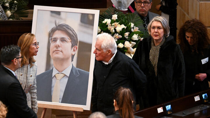A portrait of Miguel Uribe Turbay near his coffin in Bogota on August 11, 2025.