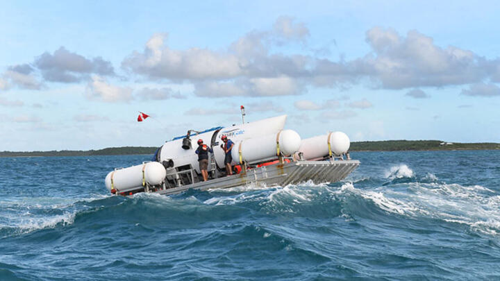 This undated image courtesy of OceanGate Expeditions, shows their Titan submersible being towed to a dive location. 