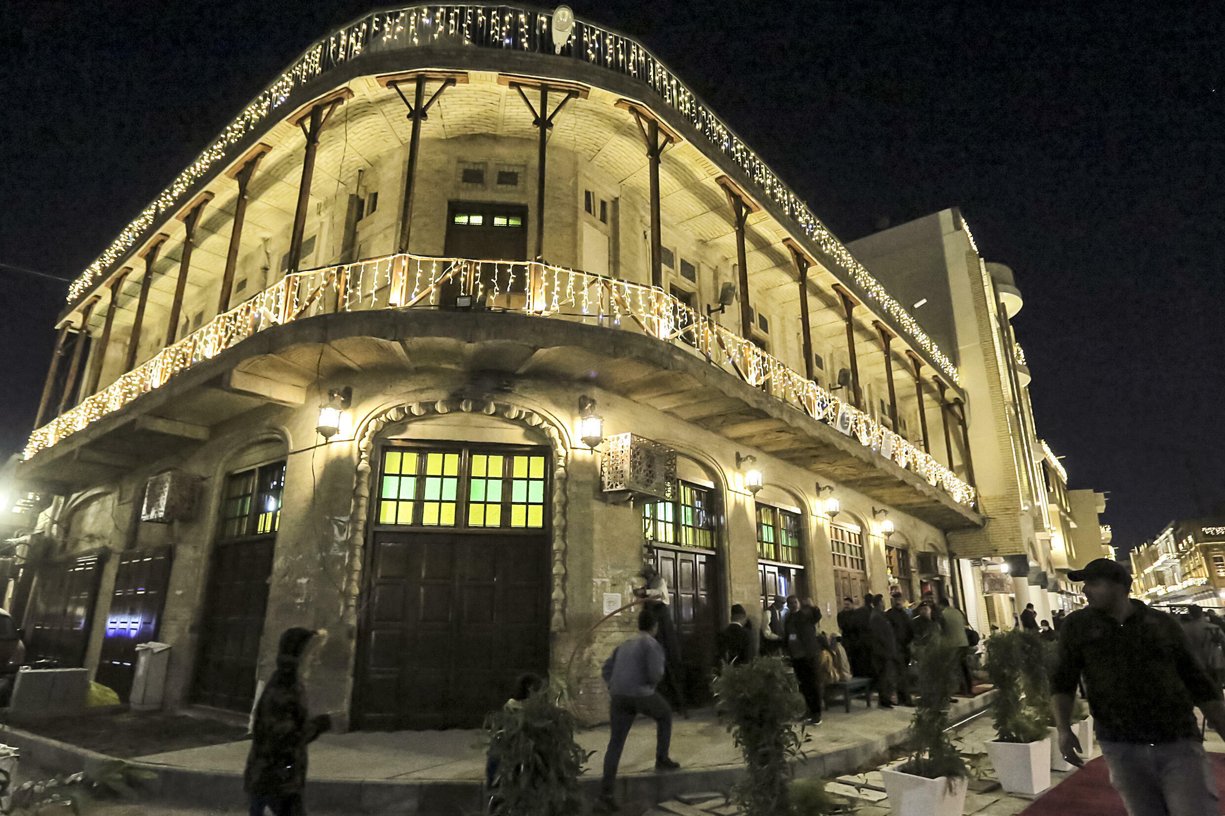 Fairy lights garlanded the ornate brick facades and wrought iron balconies