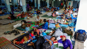 People rest at a shelter, following recent clashes along the disputed border between the two countries, in Surin province, Thailand,July 24, 2025. 