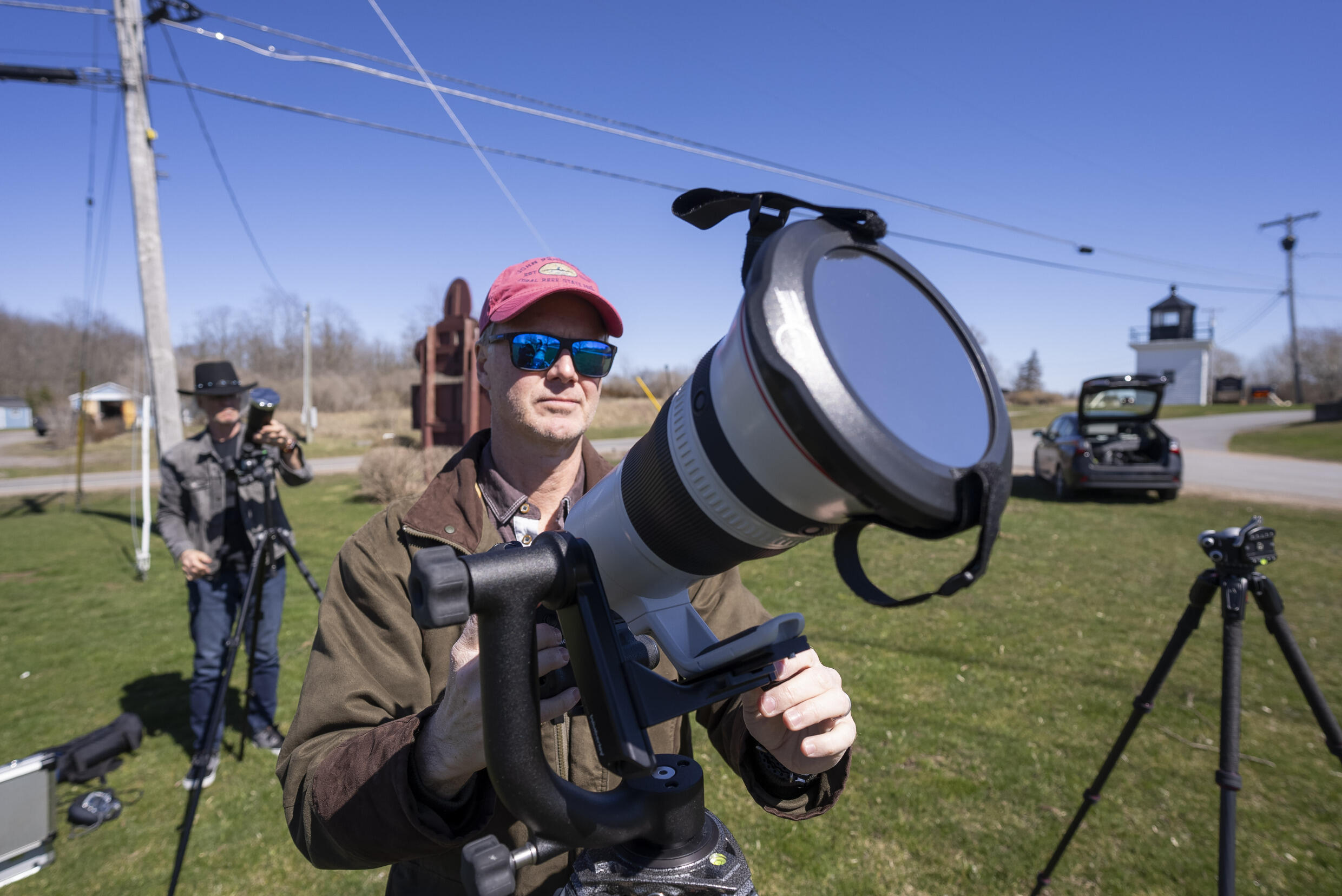 John Bills tests his camera equipment on the eve of a total solar eclipse across North America, in Cape Vincent, New York, on April 7, 2024