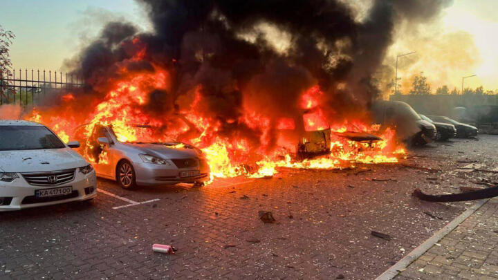 Cars are seen on fire after a Russian strike in Kyiv region, Ukraine on September 20, 2025. 