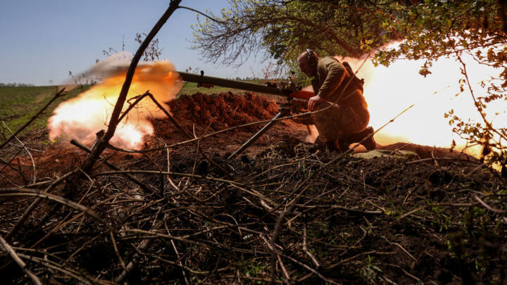A Ukrainian service member from a 28th separate mechanised brigade named after the Knights of the Winter Campaign of the Armed Forces of Ukraine, fires an anti-tank grenade launcher at a front line near Bakhmut on May 3, 2023.