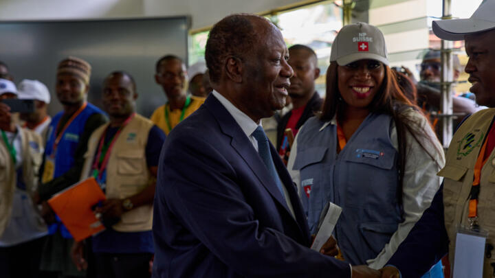 President Alassane Ouattara arrives to cast his vote at a polling station in Abidjan, Ivory Coast, on October 25, 2025. 