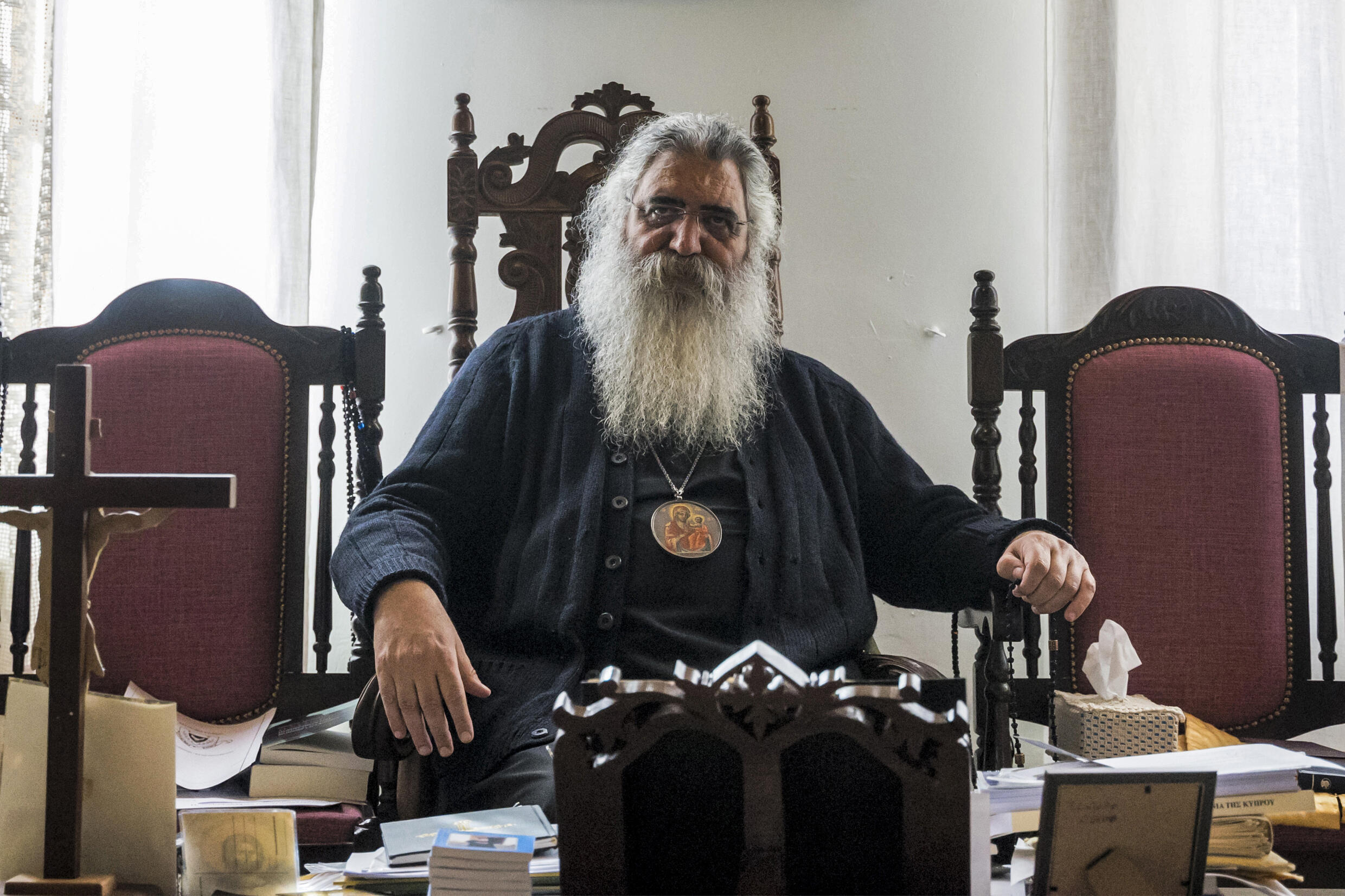 Neophytos of Morphou -- on the Moscow side of a church schism between Russia and Ukraine -- said he preferred to pray alone in his "humble cell" during Archbishop Georgios' glittering anointment ceremony