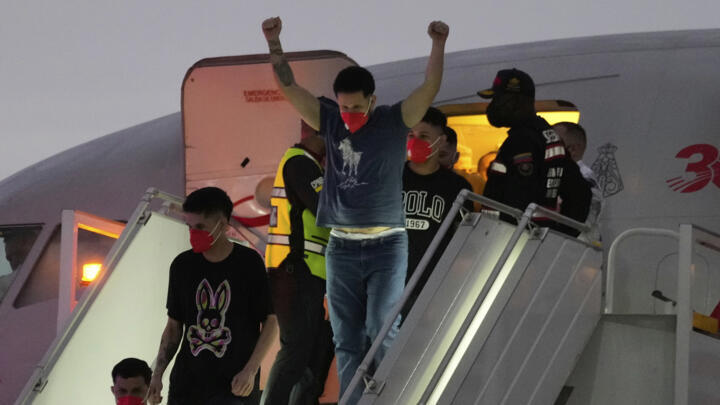 Migrants deported months ago by the US to El Salvador under the Trump administration's immigration crackdown arrive at Simon Boli­var International Airport in Maiquetia, Venezuela, on July 18, 2025.